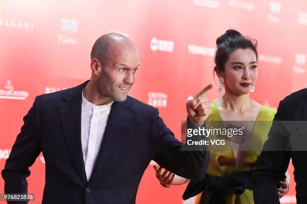English actor Jason Statham and Chinese actress Li Bingbing arrive at red carpet during the opening ceremony of the 21st Shanghai International Film...