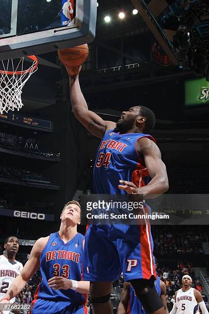 Jason Maxiell of the Detroit Pistons grabs a rebound against the Atlanta Hawks on March 13, 2010 at Philips Arena in Atlanta, Georgia. NOTE TO USER:...