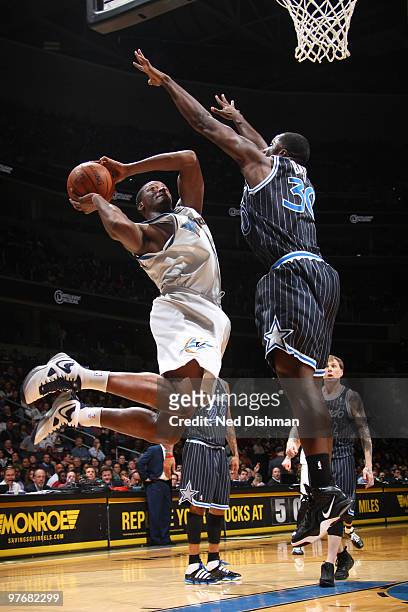 Al Thornton of the Washington Wizards shoots against Brandon Bass of the Orlando Magic at the Verizon Center on March 13, 2010 in Washington, DC....