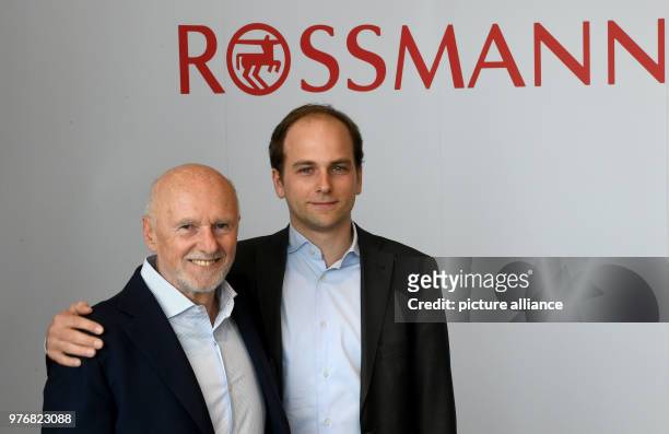 April 2018, Germany, Burgwedel: Dirk and Raoul Rossmann pose for photographs before giving a press conference about the 2017 performance of German...