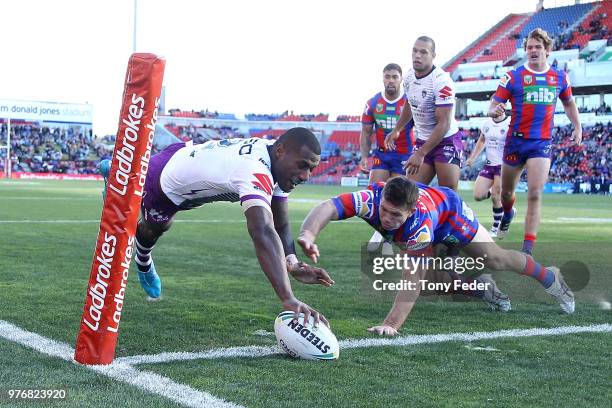 Suliasi Vunivalu of the Storm scores a try during the round 15 NRL match between the Newcastle Knights and the Melbourne Storm at McDonald Jones...