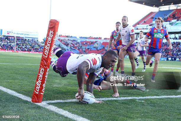 Suliasi Vunivalu of the Storm scores a try during the round 15 NRL match between the Newcastle Knights and the Melbourne Storm at McDonald Jones...