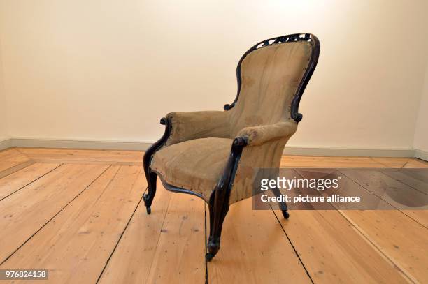 April 2018, Germany, Trier: The armchair of philosopher and economic theorist Karl Marx is on display at his birth house. The...