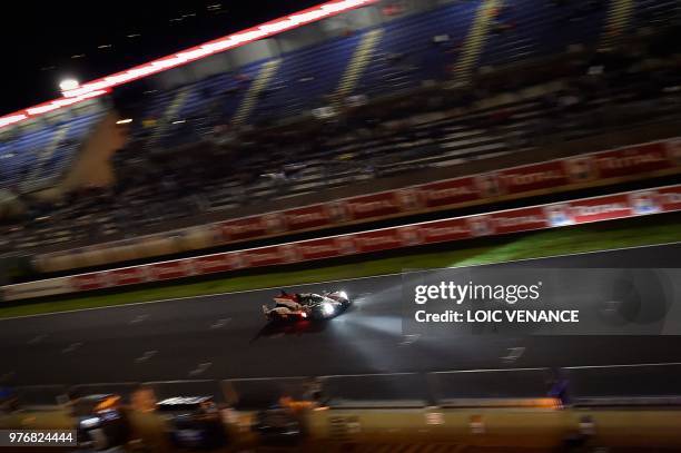 Japanese driver Kazuki Nakajima compete's in a Toyota TS050 Hybrid LMP1 during the 86th Le Mans 24-hours endurance race, at the Circuit de la Sarthe...