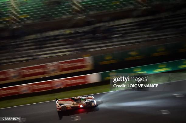 Japanese driver Kazuki Nakajima compete's in a Toyota TS050 Hybrid LMP1 during the 86th Le Mans 24-hours endurance race, at the Circuit de la Sarthe...