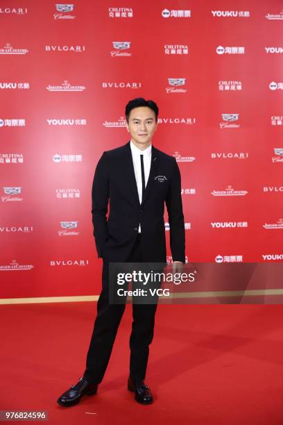 Actor Julian Cheung Chi-lam arrives at red carpet during the opening ceremony of the 21st Shanghai International Film Festival at Shanghai Grand...