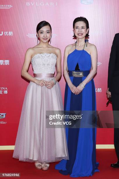 Japanese actress/singer Tomomi Itano and Japanese actress Masami Hisamoto arrive at red carpet during the opening ceremony of the 21st Shanghai...