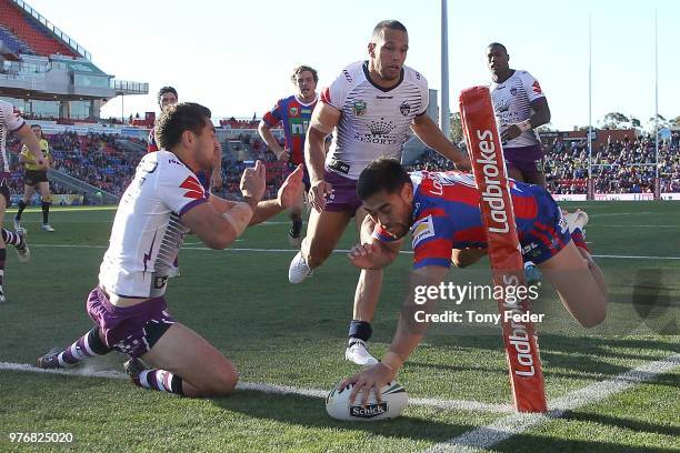 Ken Sio of the Knights scores a try during the round 15 NRL match between the Newcastle Knights and the Melbourne Storm at McDonald Jones Stadium on...