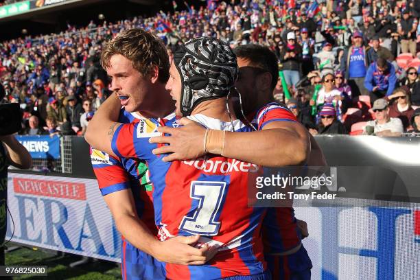 Knights players celebrate a try during the round 15 NRL match between the Newcastle Knights and the Melbourne Storm at McDonald Jones Stadium on June...