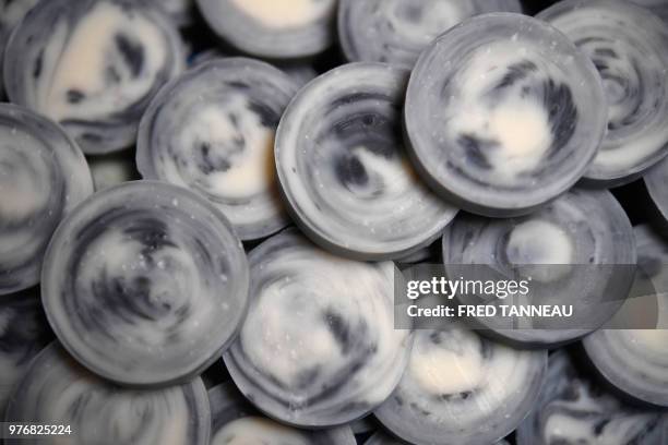 Handmade soaps produced by Tiphaine Chalaron for her label 'Route Mandarine' are pictured at her workshop in Porpoder, western France, on June 6,...