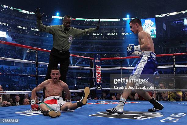 Roberto Marroquin knocks out Samuel Sanchez in the second round during the super bantamweight fight at Cowboys Stadium on March 13, 2010 in...