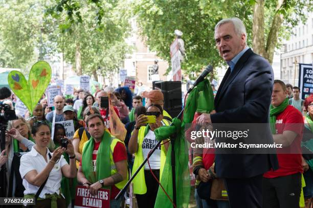 Shadow Chancellor John McDonnell makes a speech outside Downing Street in central London ahead of a protest march to the Home Office a year after the...