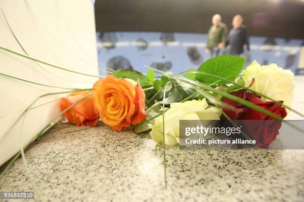 April 2018, Germany, Hamburg: Flowers laid at the Jungfernstieg S-Bahn station after it reopened to public transport following a deadly knife attack....