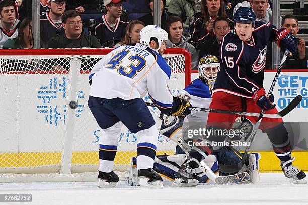 Derek Dorsett of the Columbus Blue Jackets misses the net on an attempted redirected shot as Darryl Sydor of the St. Louis Blues attempts to stick...