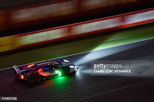 Ford GT French driver Sebastien Bourdais competes during the 86th Le Mans 24-hours endurance race, at the Circuit de la Sarthe at night on June 17,...