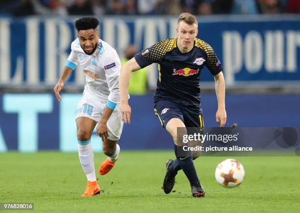 Leipzig's Lukas Klostermann and Olympique Marseille's Jordan Amavi vie for the ball during the UEFA Europa League soccer match between Olympique de...