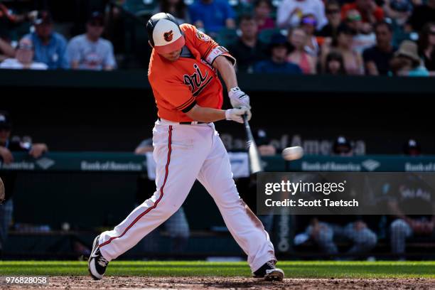 Danny Valencia of the Baltimore Orioles singles during the third inning against the Miami Marlins at Oriole Park at Camden Yards on June 16, 2018 in...