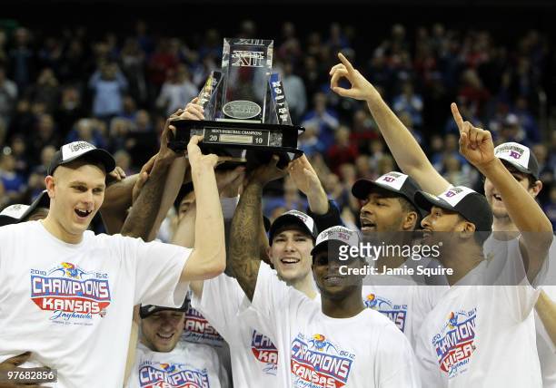 The Kansas Jayhawks display the trophy after defeating the Kansas State Wildcats to win the 2010 Phillips 66 Big 12 Men's Basketball Championship on...