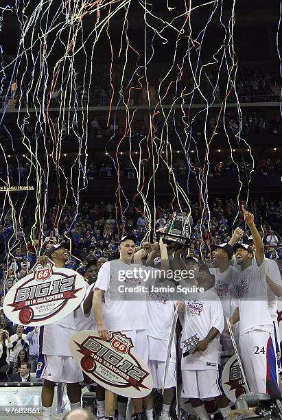 The Kansas Jayhawks display the trophy after defeating the Kansas State Wildcats to win the 2010 Phillips 66 Big 12 Men's Basketball Championship on...