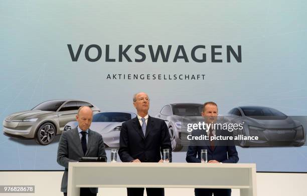 April 2018, Germany, Wolfsburg: New CEO of Volkswagen Herbert Diess , chairman of the governing body Hans Dieter Poetsch and leader of communications...