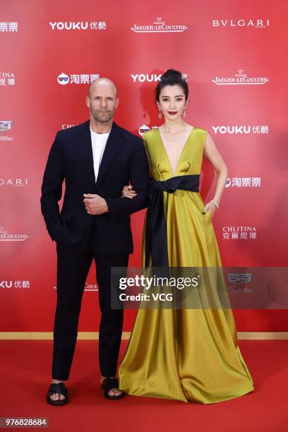 English actor Jason Statham and Chinese actress Li Bingbing arrive at red carpet during the opening ceremony of the 21st Shanghai International Film...