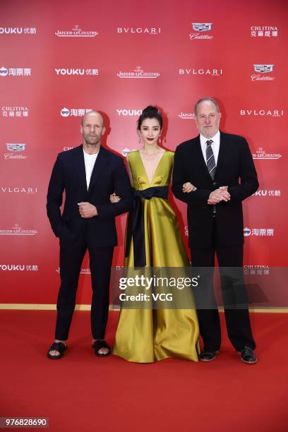 English actor Jason Statham and Chinese actress Li Bingbing arrive at red carpet during the opening ceremony of the 21st Shanghai International Film...