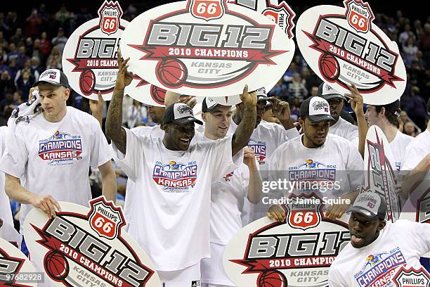 The Kansas Jayhawks celebrate with championship banners after defeating the Kansas State Wildcats to win the 2010 Phillips 66 Big 12 Men's Basketball...