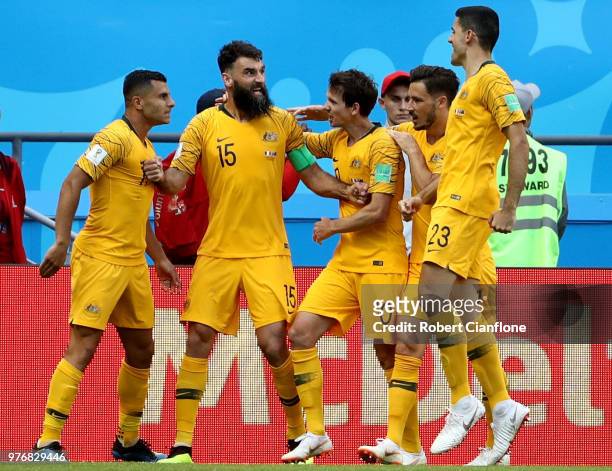 Mile Jedinak of Australia celebrates after scoring his team's first goal, from a penalty, with team mates during the 2018 FIFA World Cup Russia group...