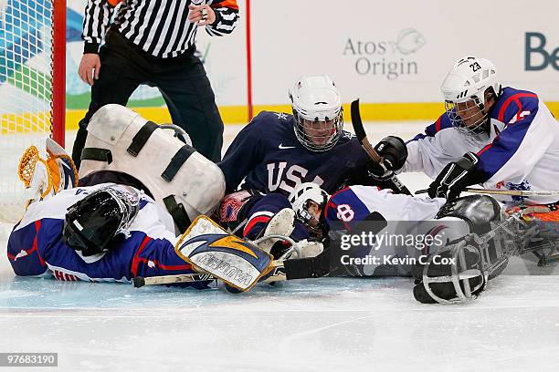 Goal keeper Hyuk-Jun Choi, Seung-Hwan Jung, Yong-Min Lee and Jong-Kyung Lee of Korea defend the net against Brad Emmerson and Adam Page of the United...