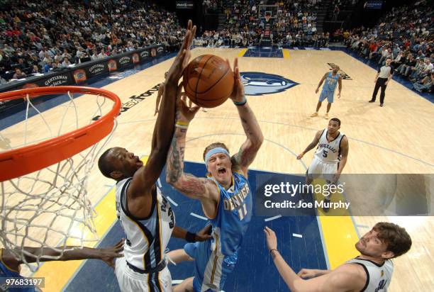 Hasheem Thabeet of the Memphis Grizzlies blocks a shot attempted by Chris Andersen of the Denver Nuggets on March 13, 2010 at FedExForum in Memphis,...