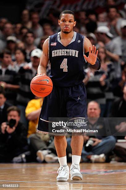 Chris Wright of the Georgetown Hoyas brings the ball up court against the West Virginia Mountaineers during the championship of the 2010 NCAA Big...