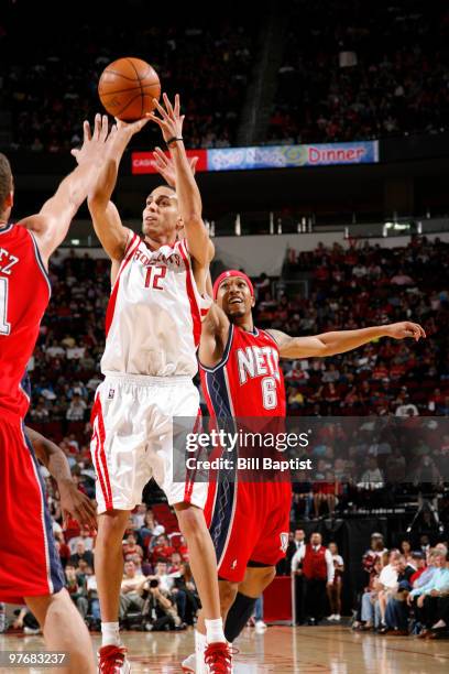 Kevin Martin of the Houston Rockets shoots the ball over Brook Lopez of the New Jersey Nets on March 13, 2010 at the Toyota Center in Houston, Texas....