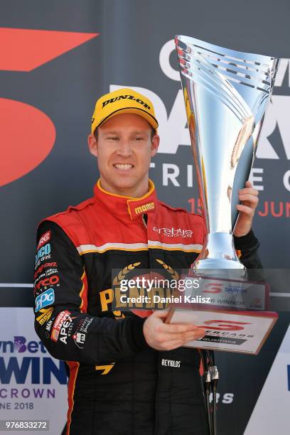 David Reynolds driver of the Erebus Penrite Racing Holden Commodore ZB celebrates on the podium after winning race 16 for the Supercars Darwin Triple...