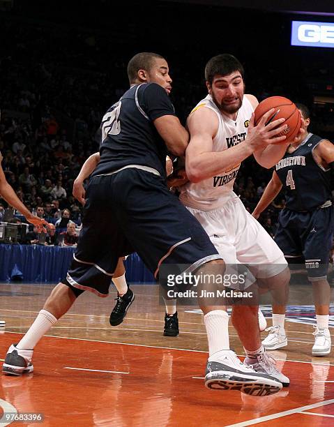 Deniz Kilicli of the West Virginia Mountaineers handles the ball against Julian Vaughn of the Georgetown Hoyas during the championship of the 2010...