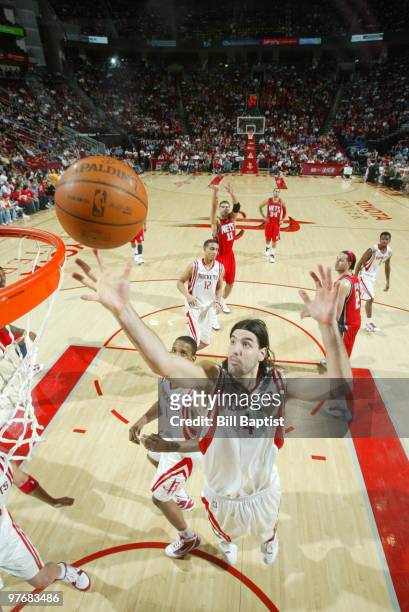 Luis Scola of the Houston Rockets shoots the ball against the New Jersey Nets on March 13, 2010 at the Toyota Center in Houston, Texas. NOTE TO USER:...
