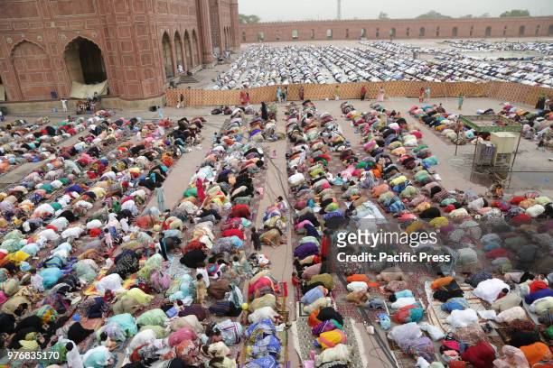 Large number of Pakistani faithful Muslims offer Eid al-Fitr prayers to celebrate the end of the holy month of Ramadan, at a historical Badshahi...