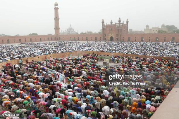 Large number of Pakistani faithful Muslims offer Eid al-Fitr prayers to celebrate the end of the holy month of Ramadan, at a historical Badshahi...