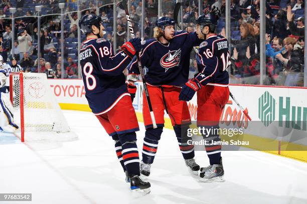 Jakub Voracek, celebrates his goal with teammates R.J. Umberger, and Derick Brassard, all of the Columbus Blue Jackets, during the third period...