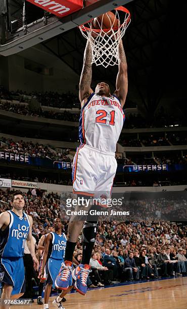 Wilson Chandler of the New York Knicks dunks against the Dallas Mavericks during a game at the American Airlines Center on March 13, 2010 in Dallas,...