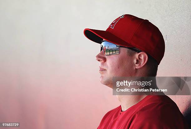 Robb Quinlan of the Los Angeles Angels of Anaheim sits in the dugout during the MLB spring training game against the Kansas City Royals at Surprise...