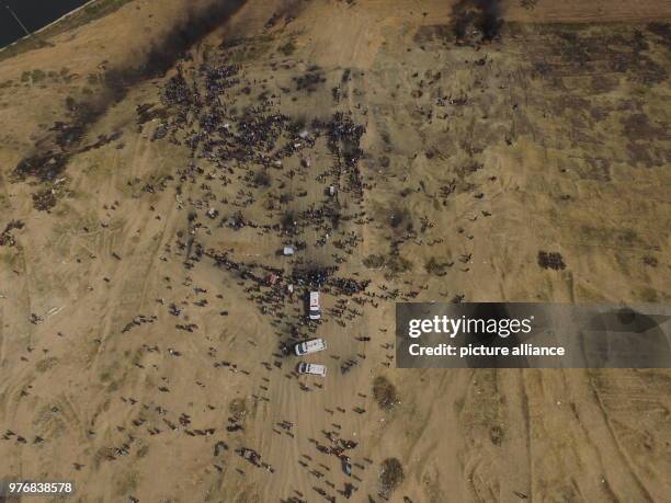 Dpatop - An aerial view of columns of smoke rising from burnt tyres during clashes between Palestinian protesters and Israeli security forces along...