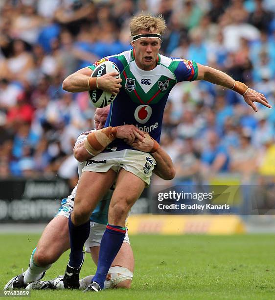 Micheal Luck of the Warriors takes on the Titans defence during the round one NRL match between the Gold Coast Titans and the Warriors at Skilled...