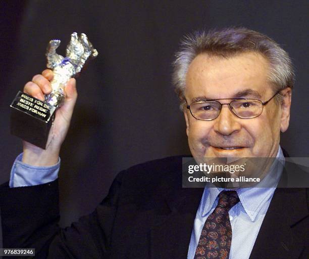 February 2000, Germany, Berlin: Milos Forman, Czech American film director, carries the silver bear award in the category 'best directory' for the...