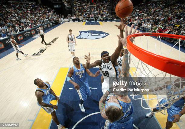 Zach Randolph of the Memphis Grizzlies shoots over Chris Andersen of the Denver Nuggets on March 13, 2010 at FedExForum in Memphis, Tennessee. NOTE...