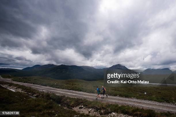 An athlete and his support on the runleg during the Celtman Extreme Triathlon on June 16, 2018 in Shieldaig, Scotland. Celtman is a part of the...