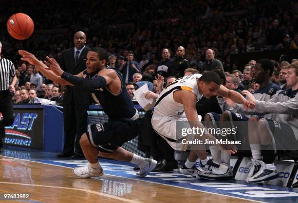 Chris Wright of the Georgetown Hoyas keeps the ball inbounds against Joe Mazzulla of the West Virginia Mountaineers during the championship of the...