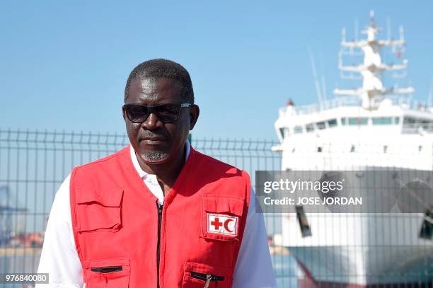 Secretary General of the International Federation of Red Cross and Red Crescent Societies Elhadj As Sy poses in front of the Italian coast guard boat...