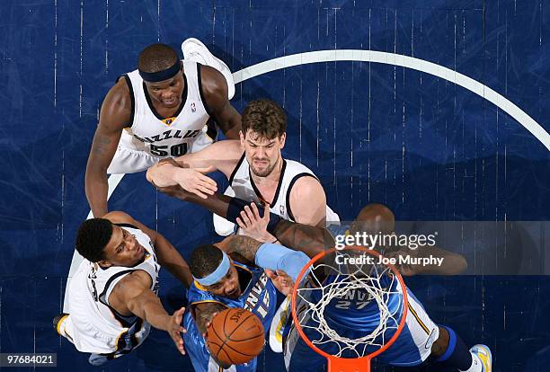 Carmelo Anthony of the Denver Nuggets shoots against Marc Gasol, Rudy Gay, and Zach Randolph of the Memphis Grizzlies on March 13, 2010 at FedExForum...