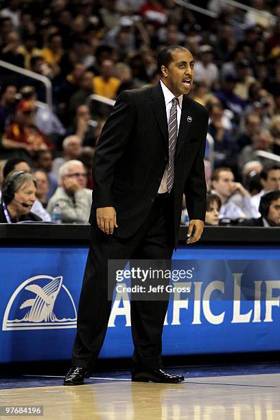 Washington Huskies head coach Lorenzo Romar calls out a play against the Cal Golden Bears in the second half during the championship game of the...