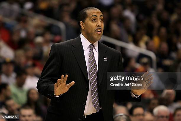 Washington Huskies head coach Lorenzo Romar calls out a play against the Cal Golden Bears in the second half during the championship game of the...